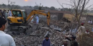 The police post and vehicles reduced to rubble following an attack on a police checkpoint in Pakistan's Bannu district.