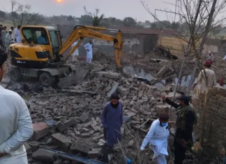 The police post and vehicles reduced to rubble following an attack on a police checkpoint in Pakistan's Bannu district.